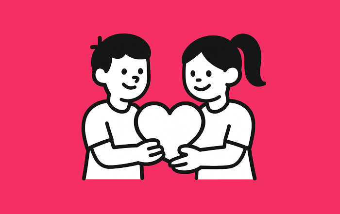 Dos niños sostienen juntos un corazón, simbolizando la educación ética, la empatía y los valores humanos.